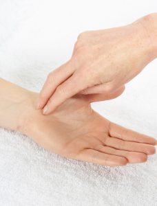 Hand therapist diagnosing Carpal Tunnel