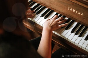 Close up of person playing the piano