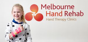 young girl giving a thumbs up after have a custom splint made for her at Melbourne Hand Rehab 