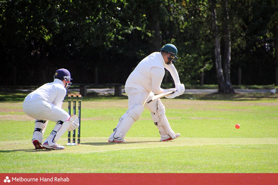 men playing cricket