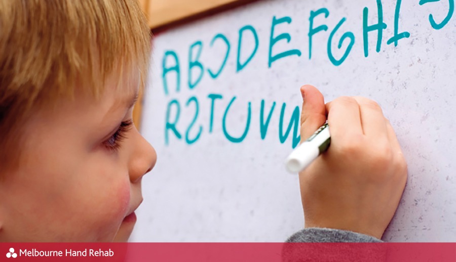 Child writing on whiteboard