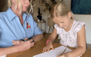 Assessment of child's handwriting by Melbourne Hand Rehab hand therapist