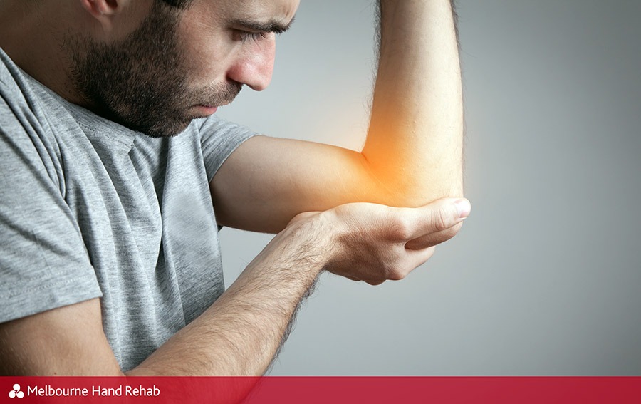 Man with possible tennis elbow injury