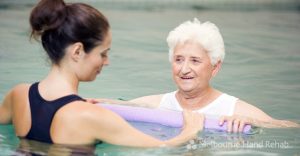 Instructor And Elderly Patient Undergoing Hydrotherapy