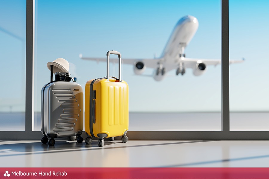 Suitcases in airport and plane taking off in the background