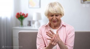 woman with painful hands - tips for living with arthritis