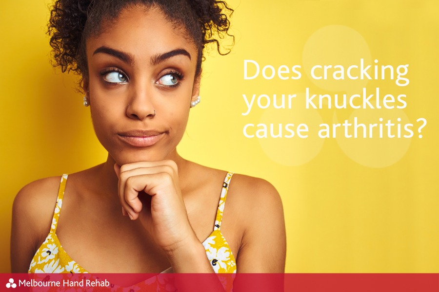 Woman ponders the question - Fact or fiction: Does cracking your knuckles cause arthritis?