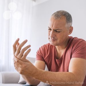 Man suffering from wrist pain