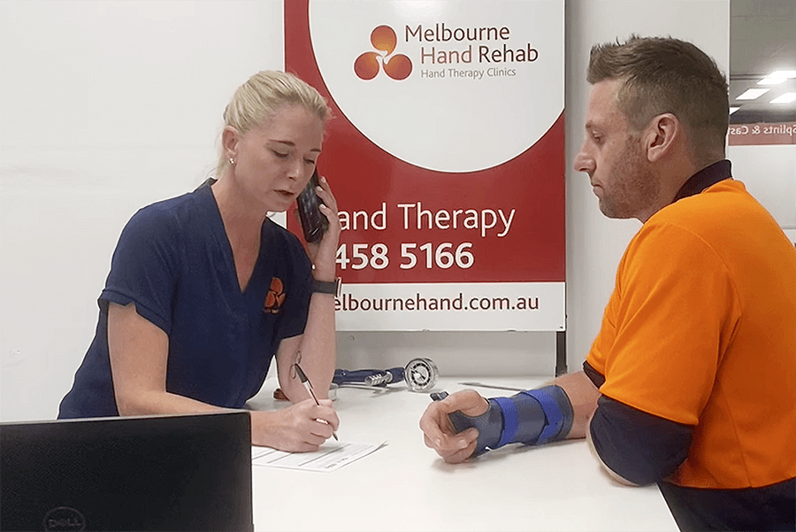 Melbourne Hand Rehab hand therapist assisting a client to return to work after an injury