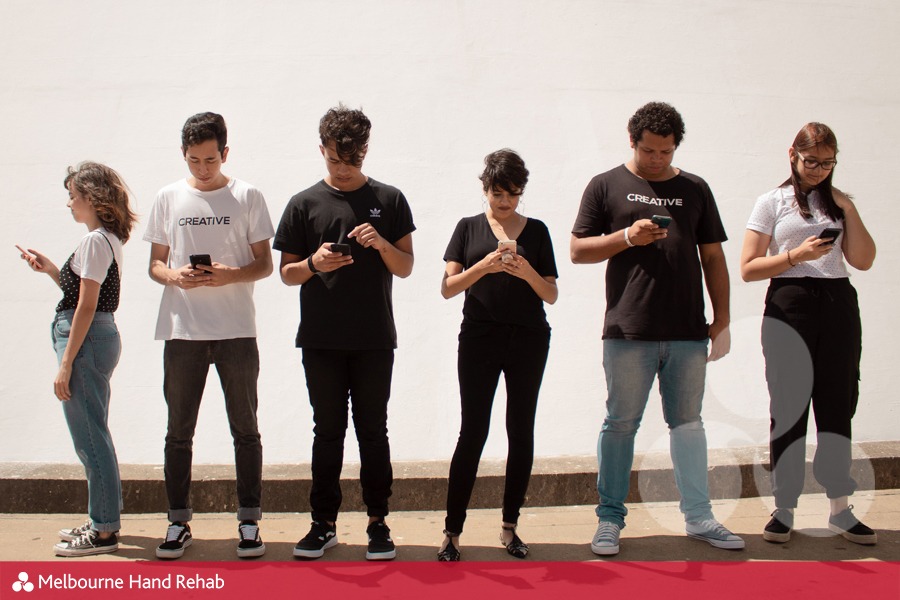 Line of people engrossed in the smartphones