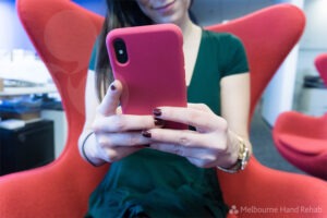 Young woman using mobile phone.