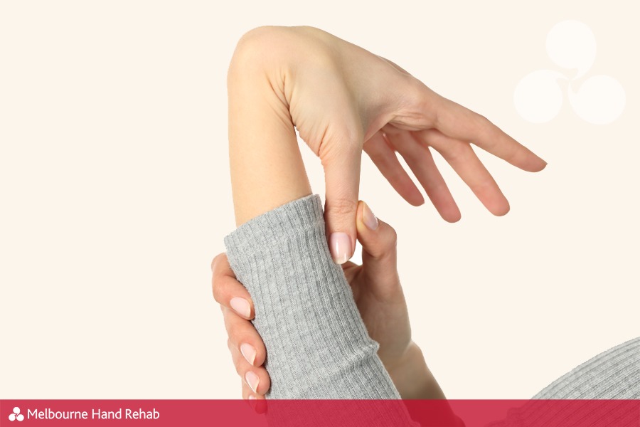 Woman with a hypermobile / double jointed hand bending on a white background.