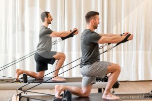 Pilates and hand therapy. Melbourne Hand Rehab client using a pilates reformer as part of there hand therapy treatment.