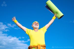 Cheerful aged men holding yoga mat.