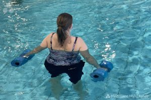 Woman participating in a Melbourne Hand Rehab hydrotherapy class